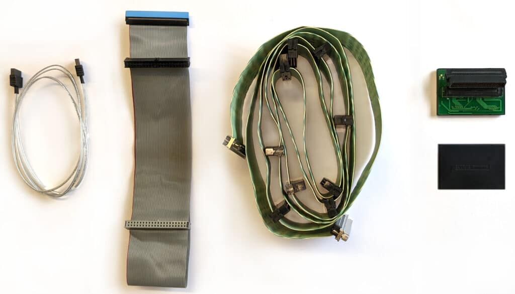 From right to left: SCSI, PATA and SATA cables. The black component on the right is a SCSI terminator.